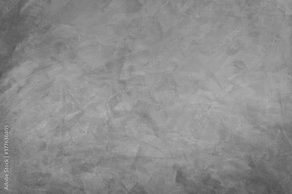 Naklejka premium Abstract background of modern loft cement texture. The gray concrete wall has some scratch without a fixed pattern. Can be used in graphic design and for creating various backgrounds.
