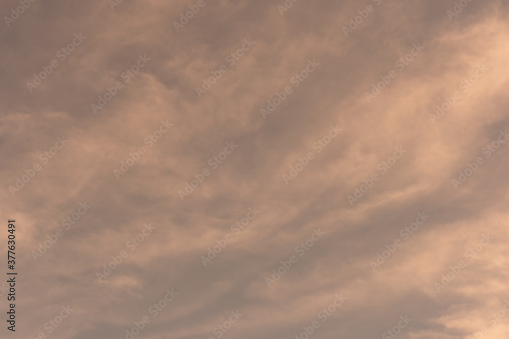 Obraz premium Orange-gold moving clouds abstract background image.
