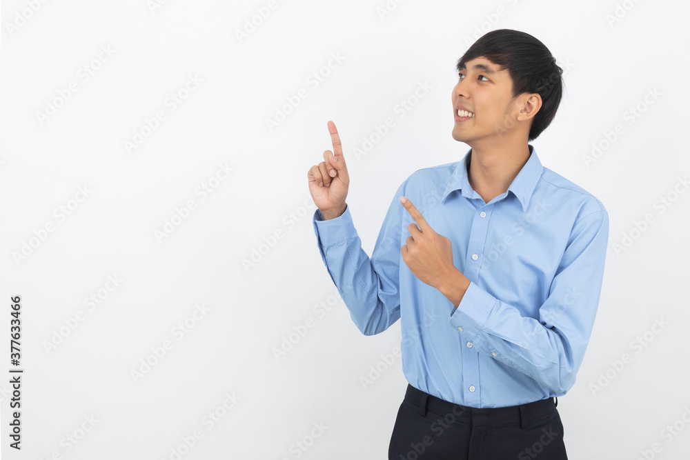 Young asian business man with blue shirt pointing to the side with a hand to present a product or an idea isolated on white background. Young asian business man with blue shirt pointing to the side with a hand to present a product or an idea isolated on white background.