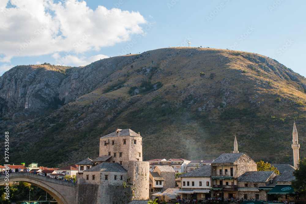 Beautiful view on Mostar city with old bridge, mosque and ancient buildings on Neretva river in Bosnia and Herzegovina. popular tourist destination.