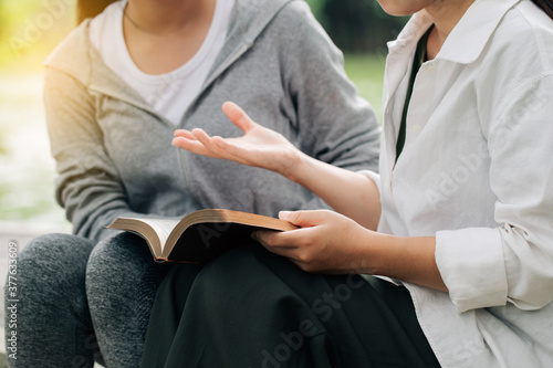Slika na platnu Two women studying and  talking about the bible .