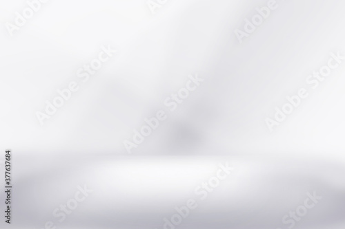 White and grey showcase for product background. Abstract gray gradient stage studio backdrop, empty room interior blank wall and floor with light from spotlight for product display