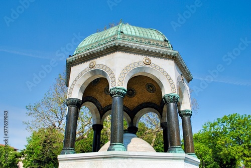 The beautiful neo-Byzantine style of German Kaiser Wilhelm gazebo fountain, Alman Cesmesi with golden mosaics dome in Sultan Ahmet square. Istanbul Turkey photo