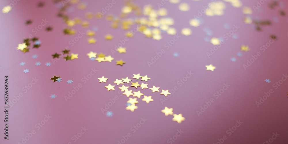 Stars and snowflakes on a pink background, from above Stars and snowflakes on a pink background, from above