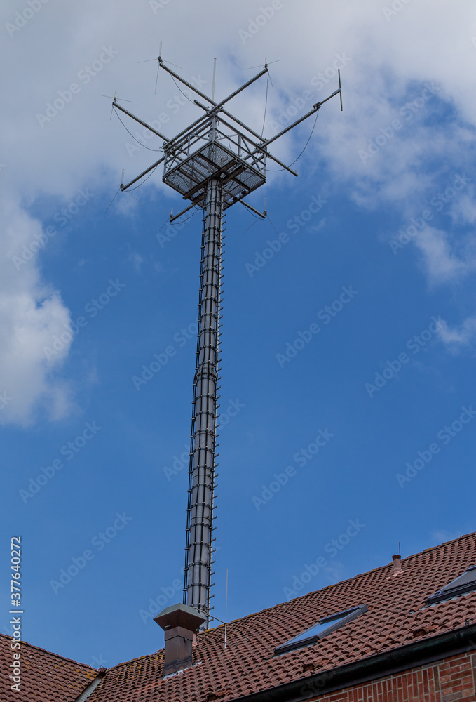 Telecommunication tower with wireless antennas on sunset sky Telecommunication tower with wireless antennas on sunset sky