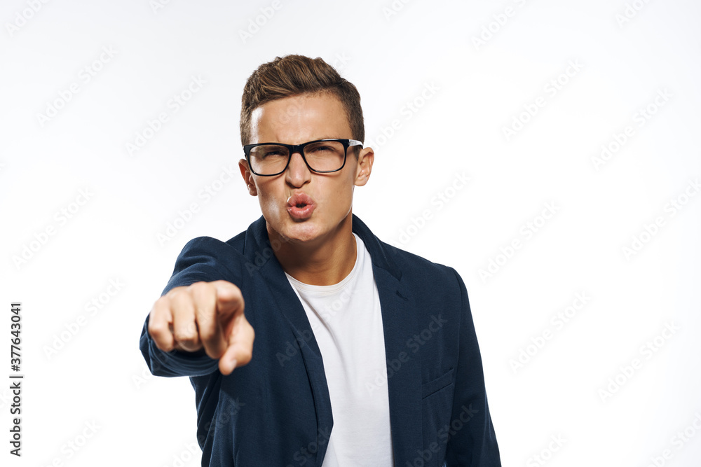 Fototapeta premium Business man in a jacket with glasses emotions official manager light background studio
