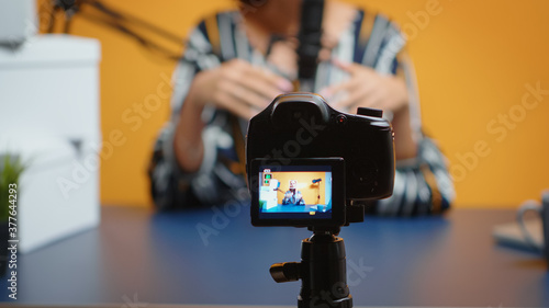 Close up of video blogger recording subscribers present giveaway. Creative content creator social media star influencer expert vlogger recording online internet web podcast gift for audience