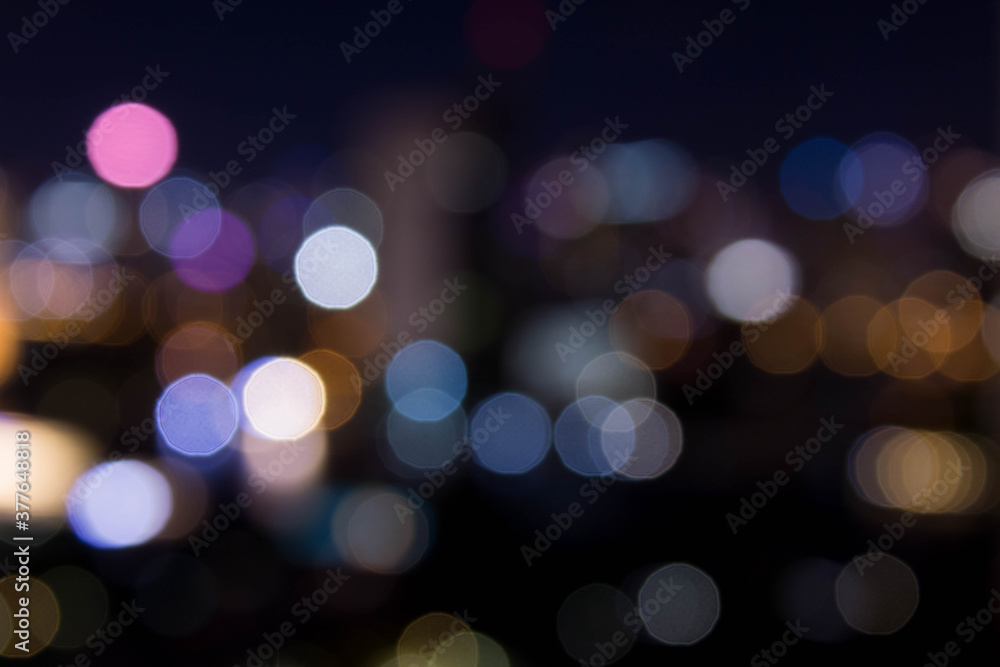 abstract background with bokeh defocused lights from cityscape at night