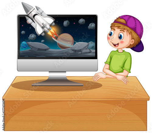 Boy next to computer with space background