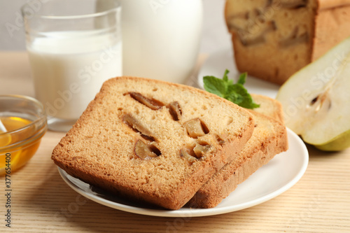 Composition with tasty pear bread on wooden table, closeup. Homemade cake