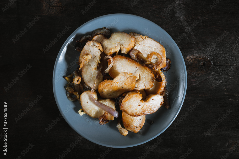 Roasted chicken with onion on the plate top view Roasted chicken with onion on the plate top view