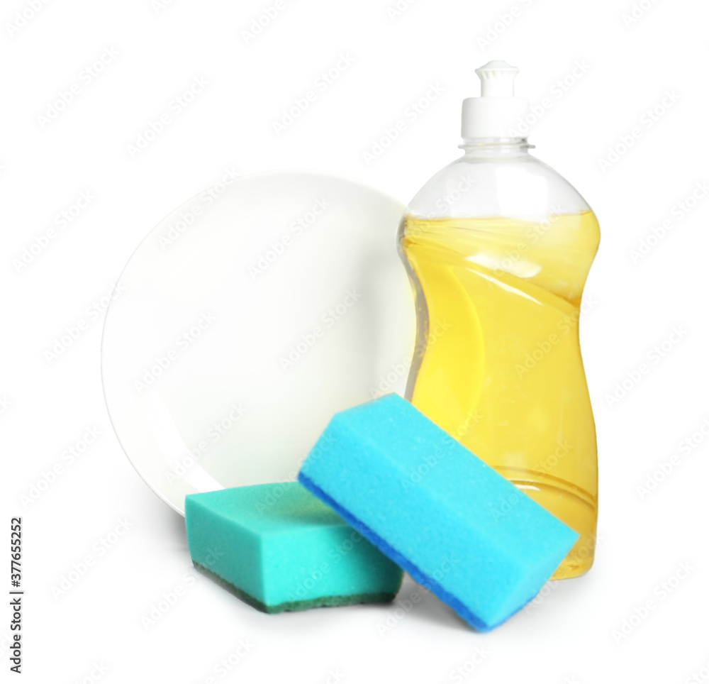 Detergent, plate and sponges on light background, space for text. Clean dishes Detergent, plate and sponges on light background, space for text. Clean dishes