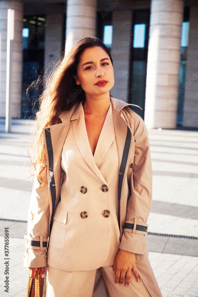 Fototapeta premium young pretty brunette woman in fashion suit at business building posing cheerful, lifestyle people concept