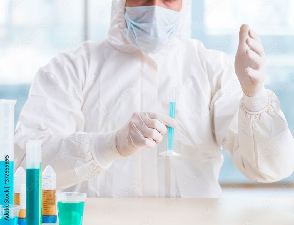 Young chemist student working in lab on chemicals Young chemist student working in lab on chemicals