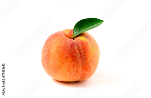 Fresh sweet peach with green leaf isolated on white background.