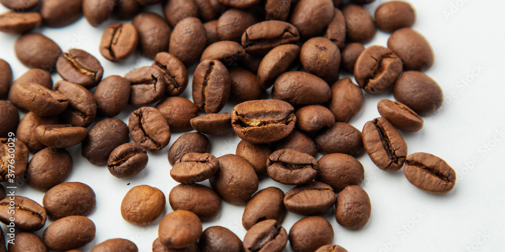 Group of coffee beans isolated on white background. Selective focus. Group of coffee beans isolated on white background. Selective focus.