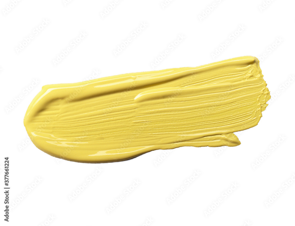 Stroke of yellow color correcting concealer isolated on white