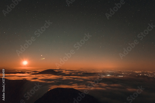 Moonrise  comet and stars landscape above the mountain in autumn season