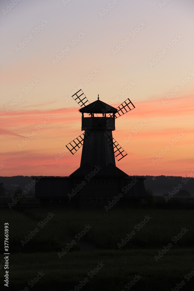 Silhouette of the windmill at sunset