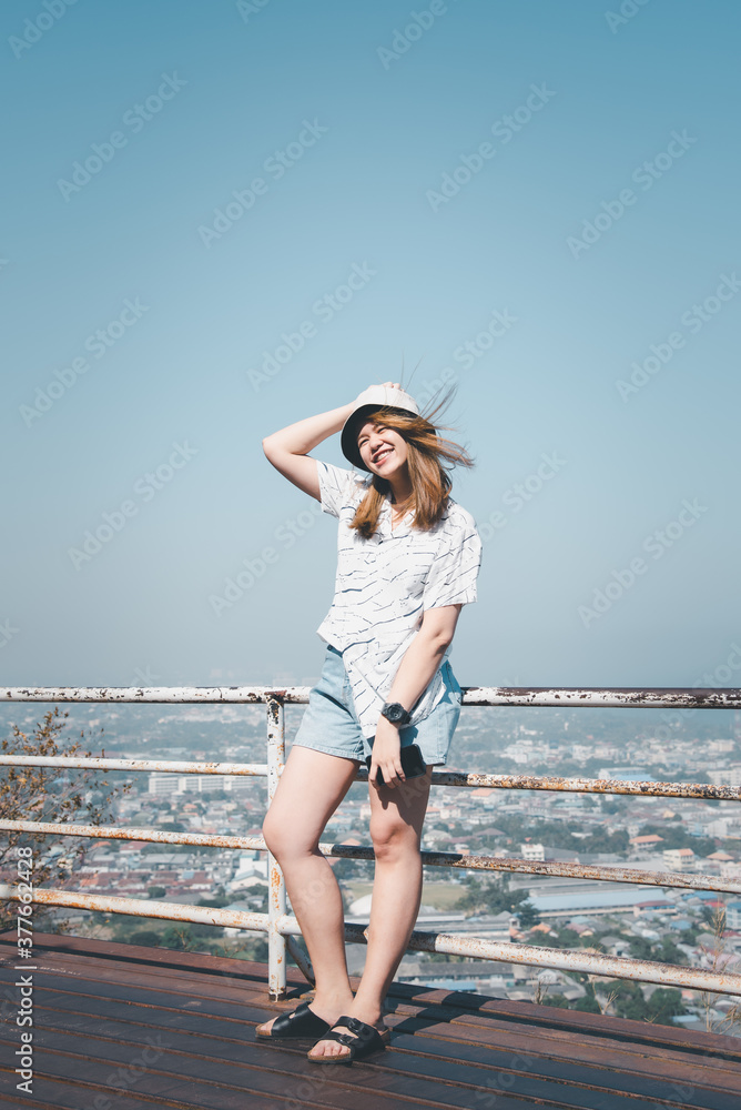 Woman relax at landscape viewpoint on mountain