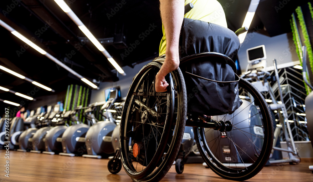 Fototapeta premium Disabled man training in the gym of rehabilitation center