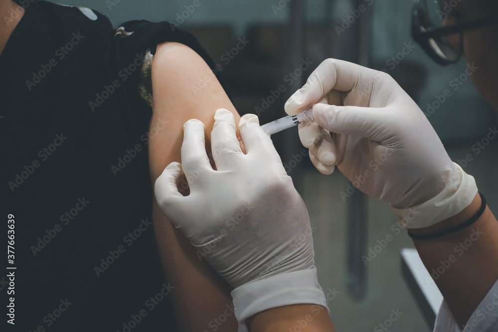 Patient asian woman get vaccinated the flu covid19