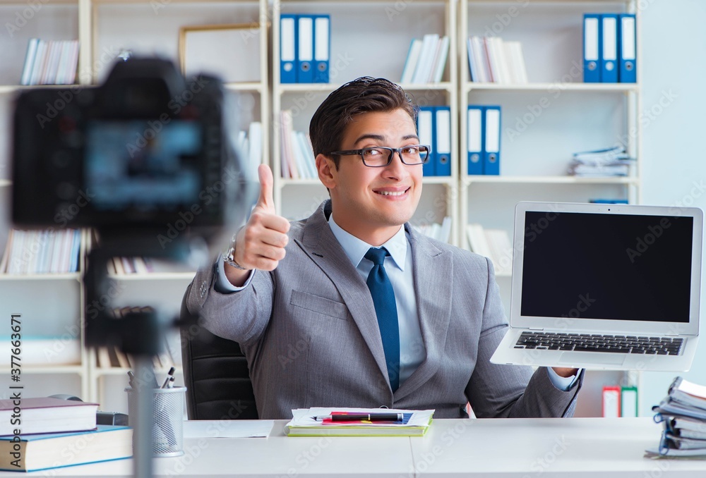 Business blogger doing webcast for his subscribers Business blogger doing webcast for his subscribers
