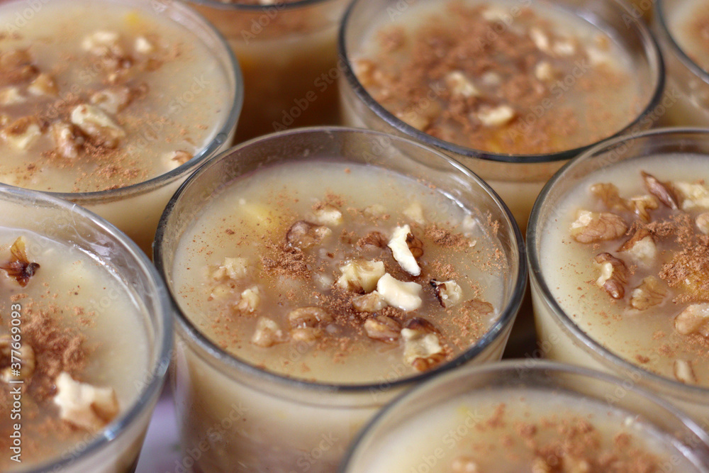 Traditional Turkish dessert Asure with walnuts. (Noah's Pudding). Close up. Traditional Turkish dessert Asure with walnuts. (Noah's Pudding). Close up.