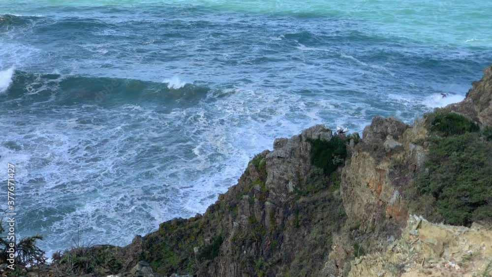 ocean view from the top of a cliff. High waves ocean view from the top of a cliff. High waves