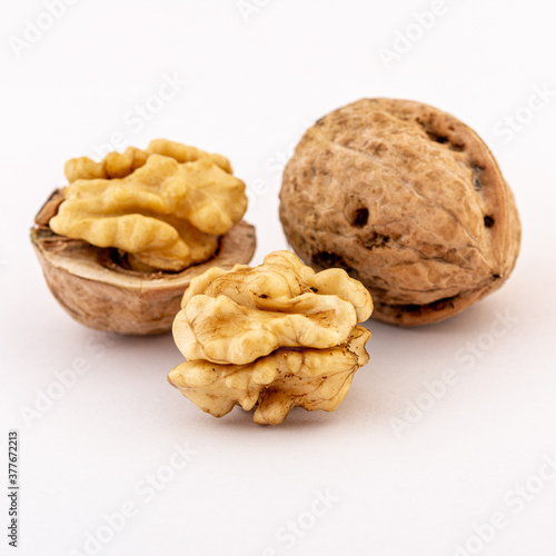 ripe walnuts on white background