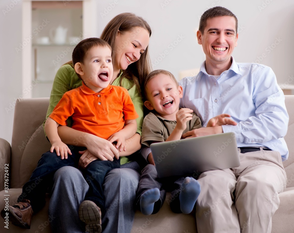 Young family surfing internet and looking at photos