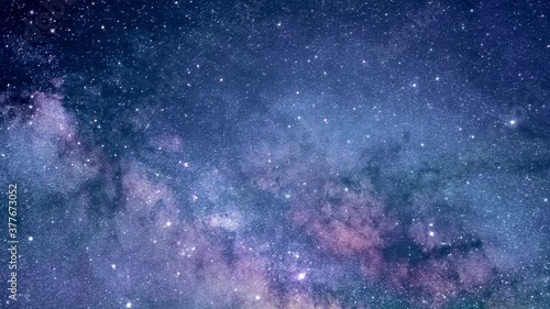 Camera flying through the clouds and star field in outer space.