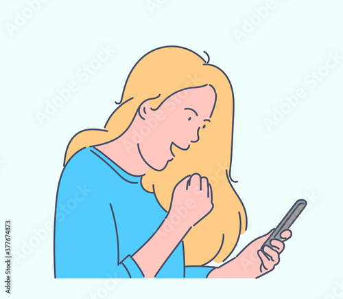 Online communication, social media or network concept. Happy woman blogger communicates in social media. Young girl is addicted to social networks. Student uses mobile phone for typing messages.