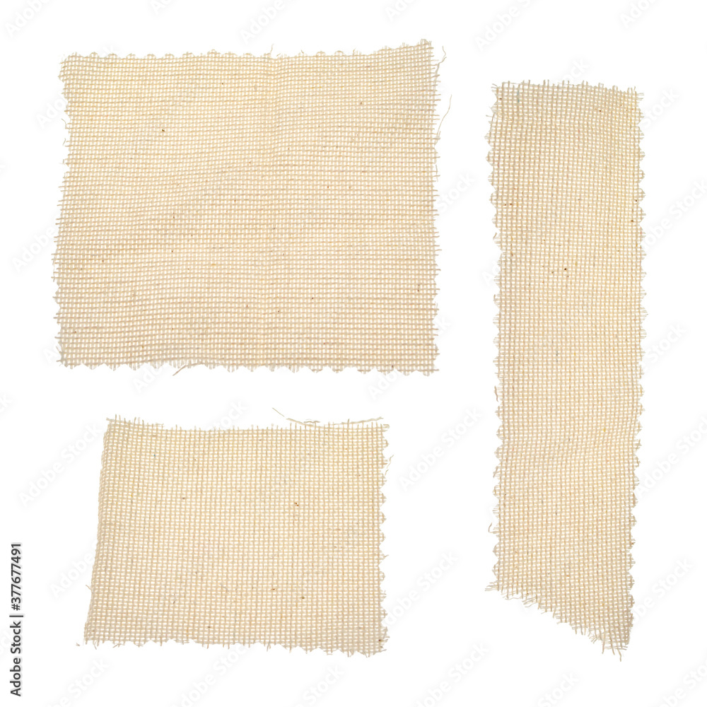 Square, rectangular long pieces of canvas, cut burlap fabric, patch for  clothes, dry garbage, scraps of fabric, background for text from fabric  isolated on a white background. Stock Photo
