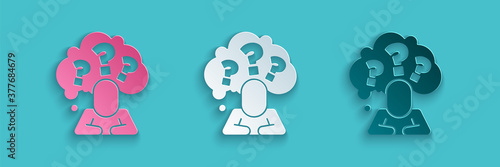 Paper cut Human head with question mark icon isolated on blue background. Paper art style. Vector.