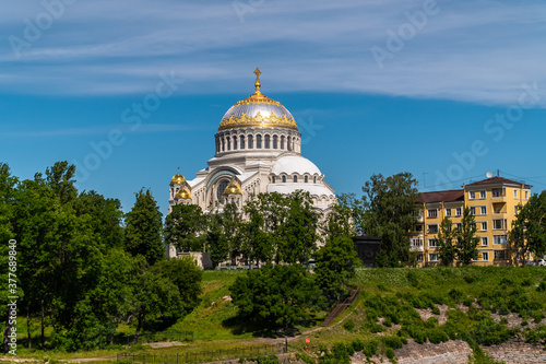Summer views of St. Nicholas Sea Cathedral from the Summer garden in Kronstadt. © yurisuslov