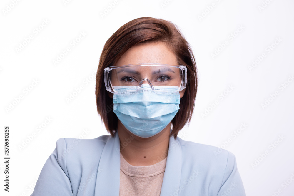 Doctor scientist or nurse portrait with facemask and protective glasses Doctor scientist or nurse portrait with facemask and protective glasses