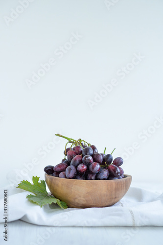 Fresh grapes in a wooden bowl