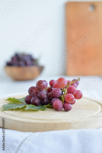 Fresh grapes in a wooden bowl