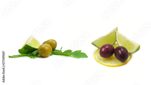 Two olives and piece of lemon and lime isolated on white