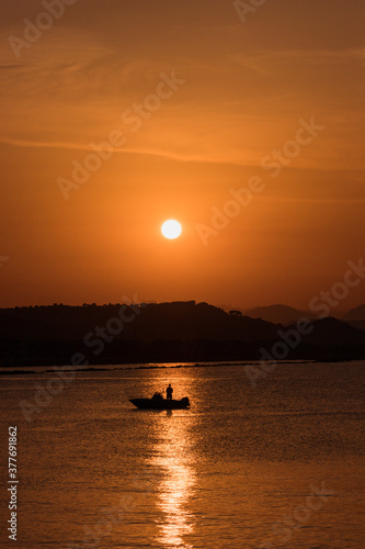 Fishman in the boat sunset (Pescara)