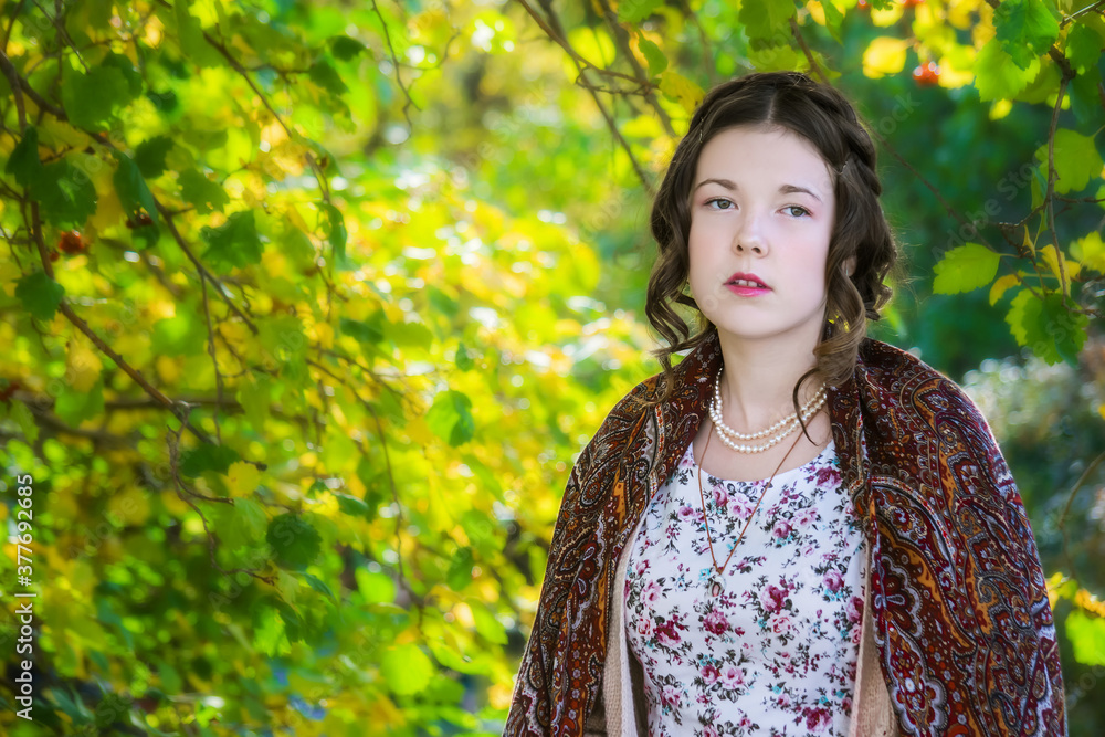 Sad women in a shawl in the park