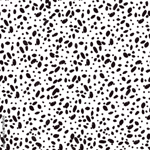 Seamless vector pattern with ink-black dots isolated on white background.  Trendy graphic design for ceramic tile wallpapers  textile  wrapping gifts