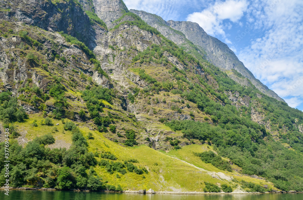 Mountains and fjord Sognefjord in Norway, Scandinavia. Tourism vacation and travel. Mountains and fjord Sognefjord in Norway, Scandinavia. Tourism vacation and travel.