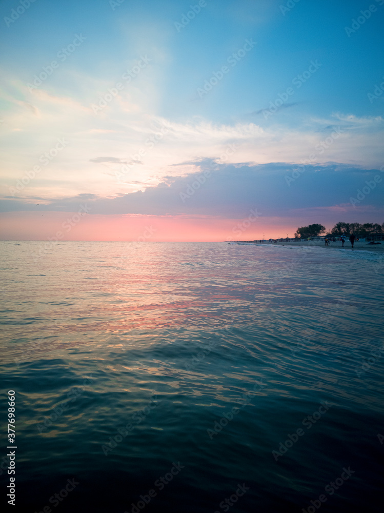 Pink sunset by the sea. Summer days. Foam waves. Beautifull. Pink sunset by the sea. Summer days. Foam waves. Beautifull.