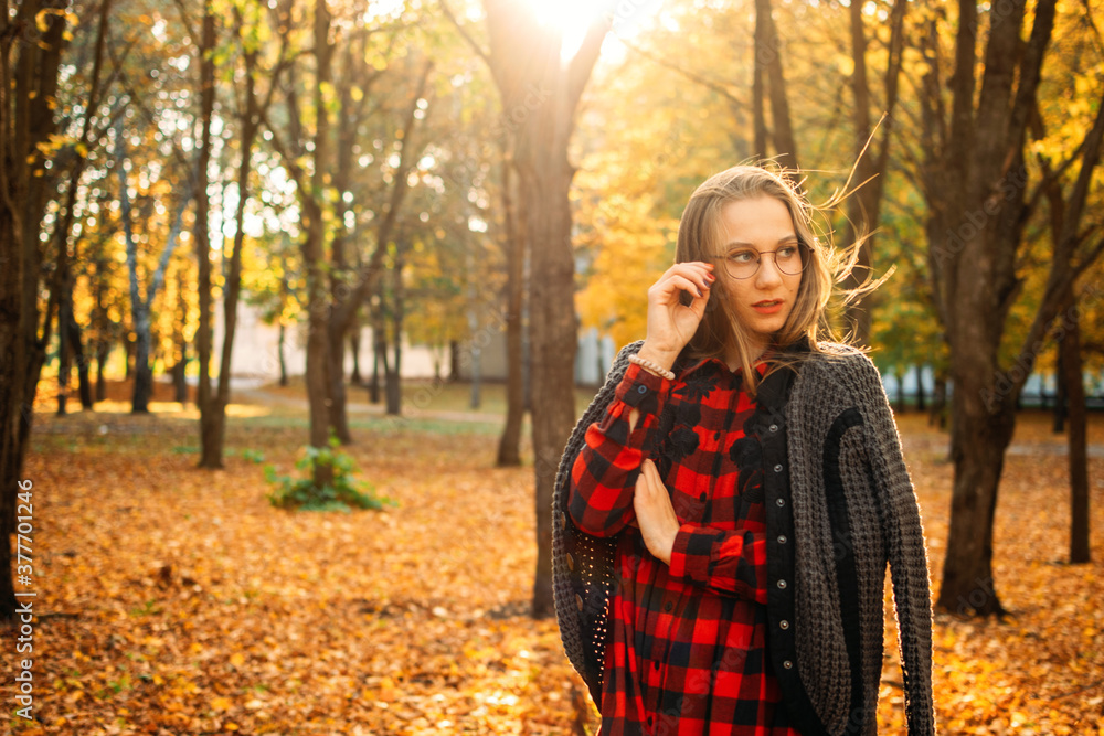 Fall its coming, Hello autumn. Beautiful blond girl on autumn background. Stylish young lady in park. Beautiful blond girl outdoors Fall its coming, Hello autumn. Beautiful blond girl on autumn background. Stylish young lady in park. Beautiful blond girl outdoors