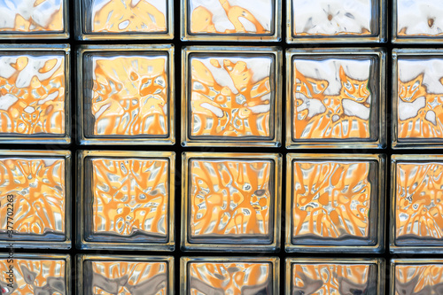 Window mosaic - architecture detail of glass squared tiles. Transparent surface and frames.