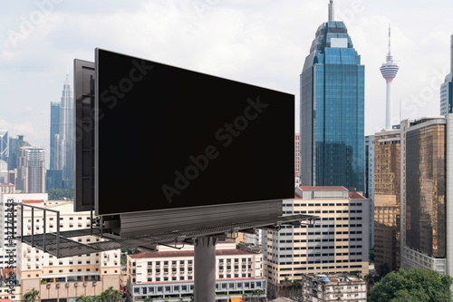 Photography Blank black road billboard with Kuala Lumpur cityscape background at day time
