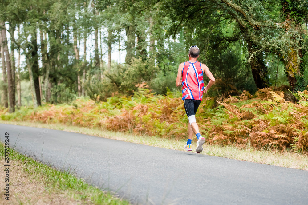 Fototapeta premium middle-aged man running in nature