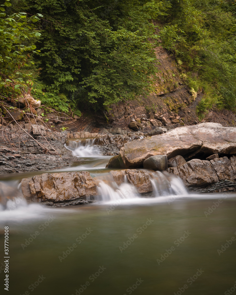 Beautiful cascade of mountain waterfall in Ukrainian Carpathians Beautiful cascade of mountain waterfall in Ukrainian Carpathians